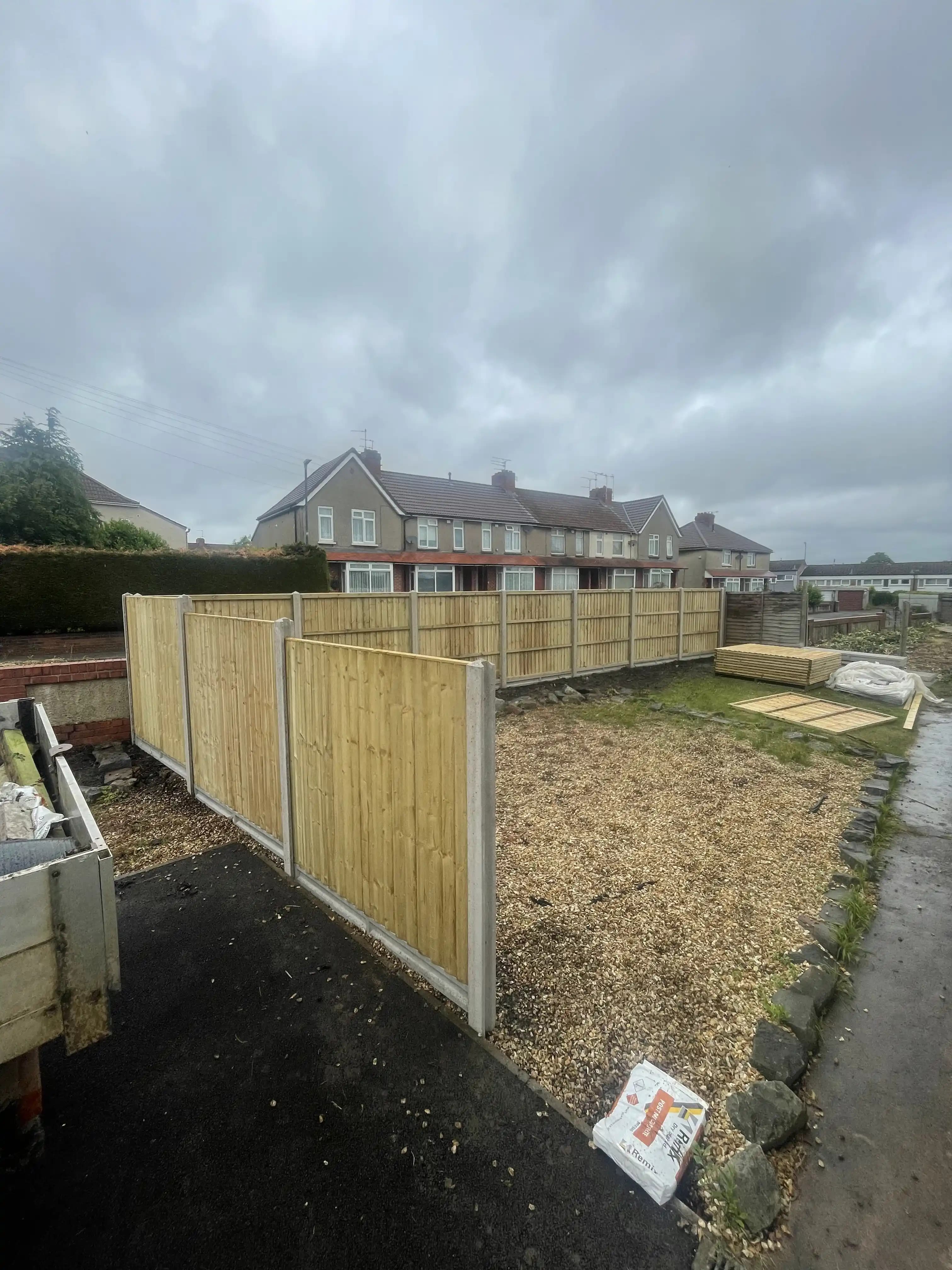 New build garden fence installation with gravel boards