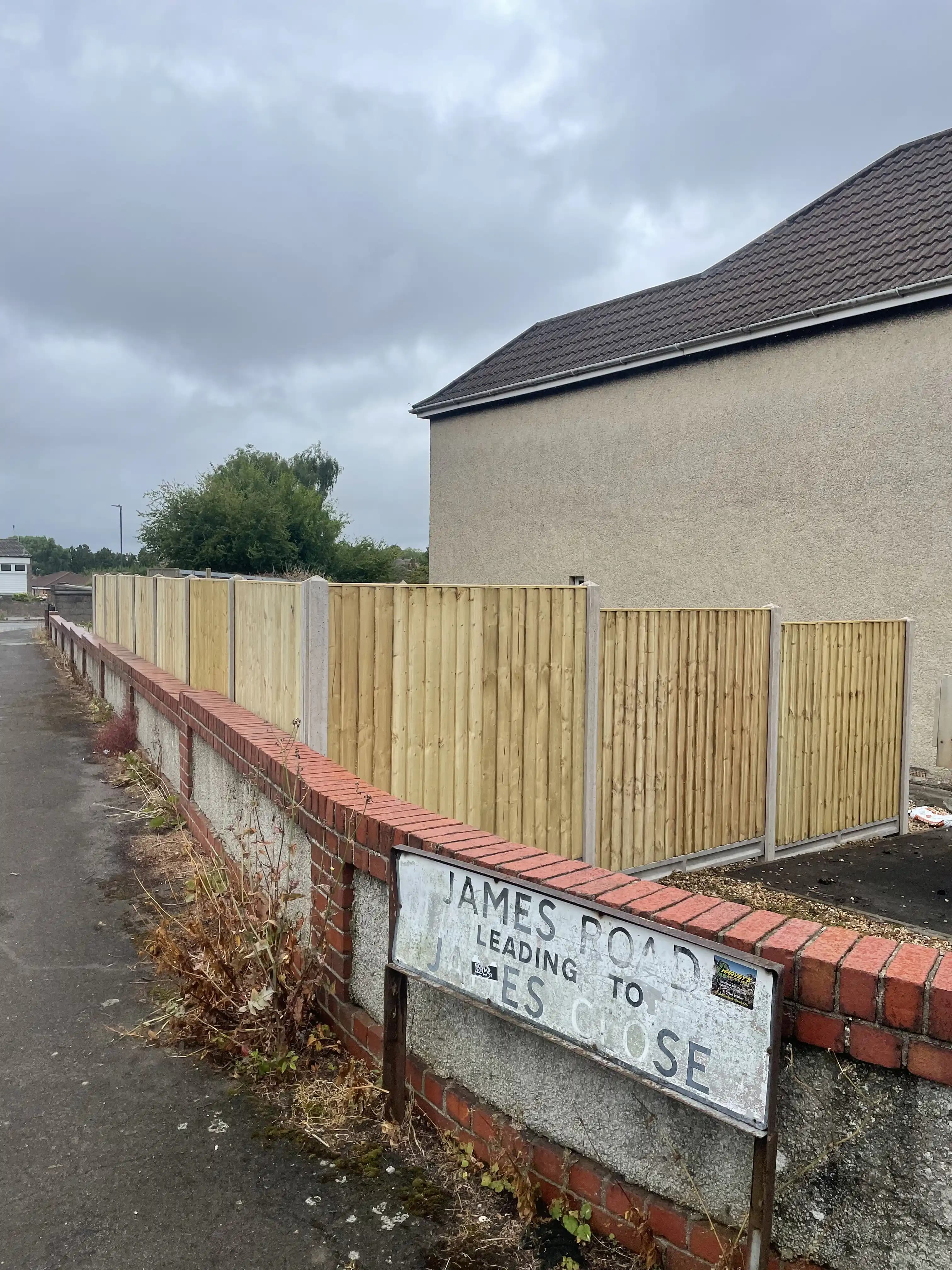 Side boundary closeboard fence beside a new build house