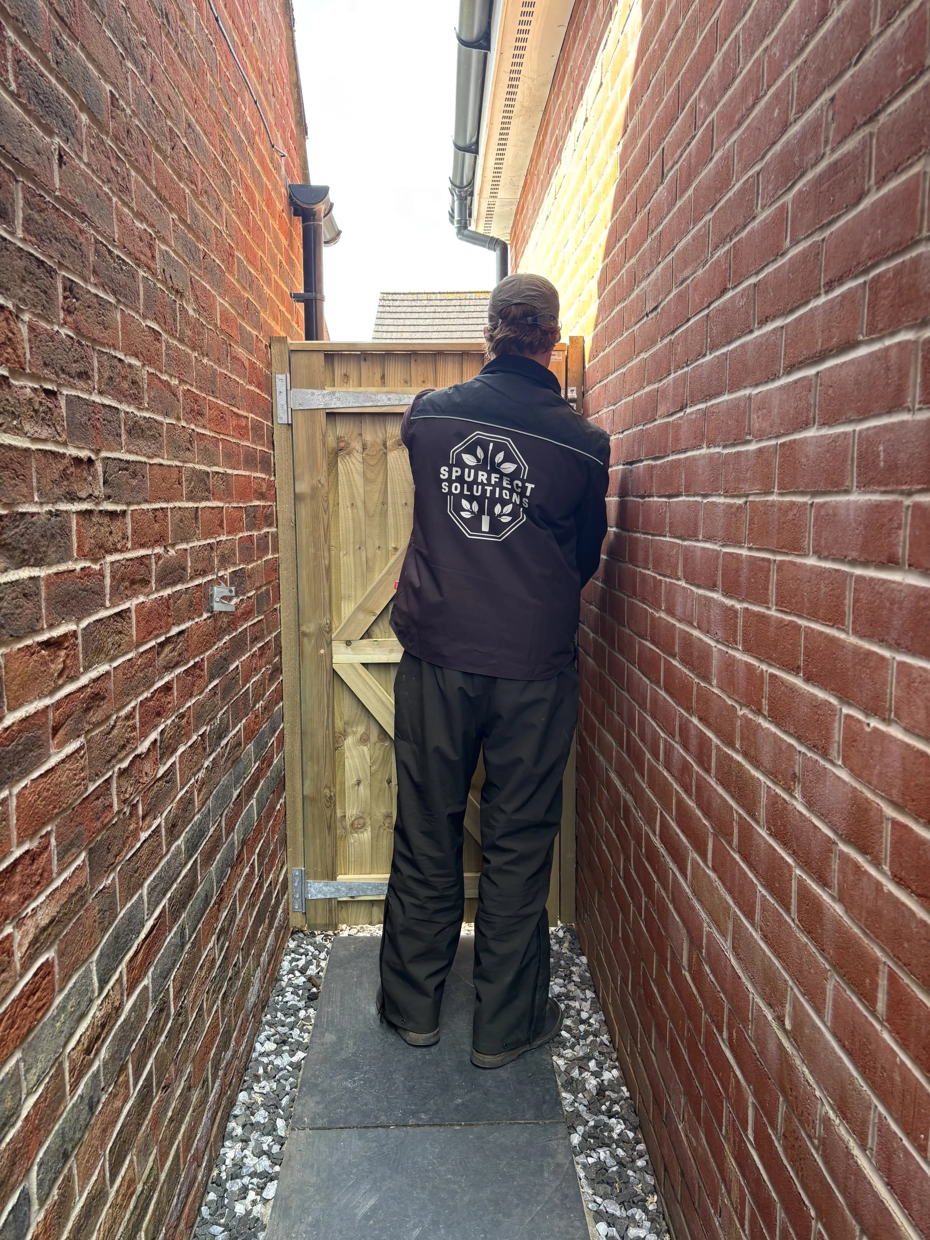 Timber side gate installation in a narrow brick side return