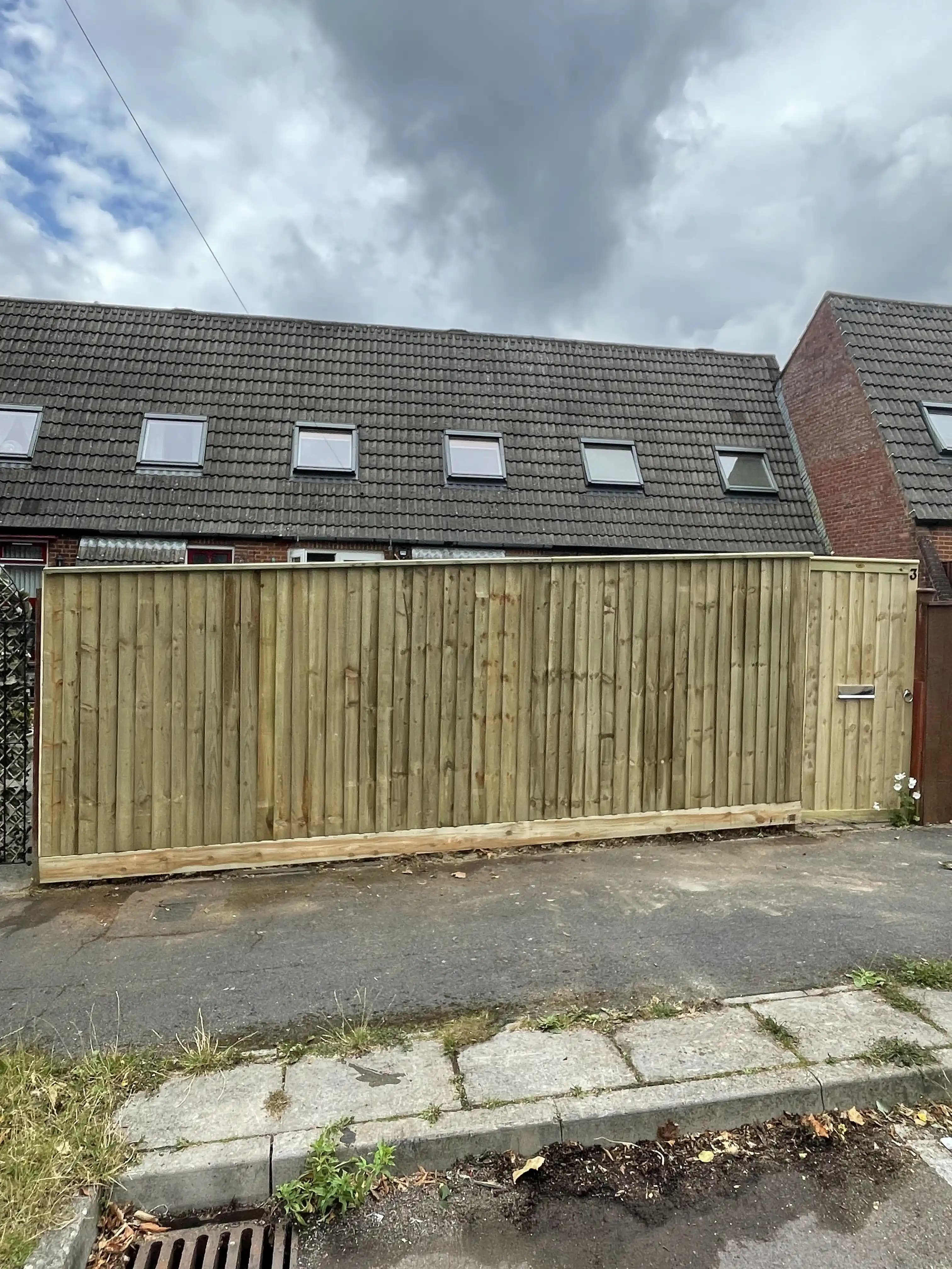 Street facing closeboard fence panels outside a house