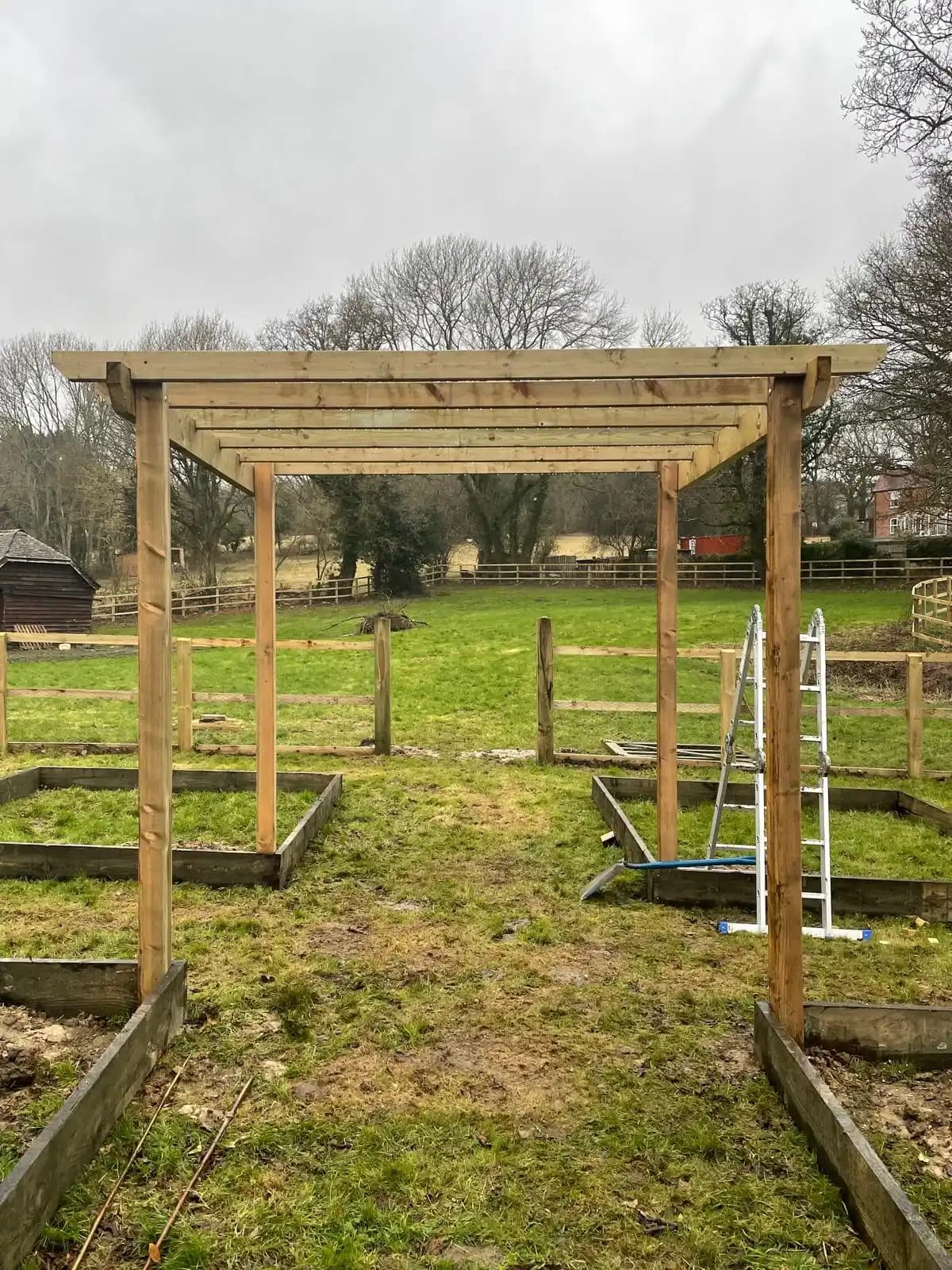 Timber arbour frame forming a garden entrance